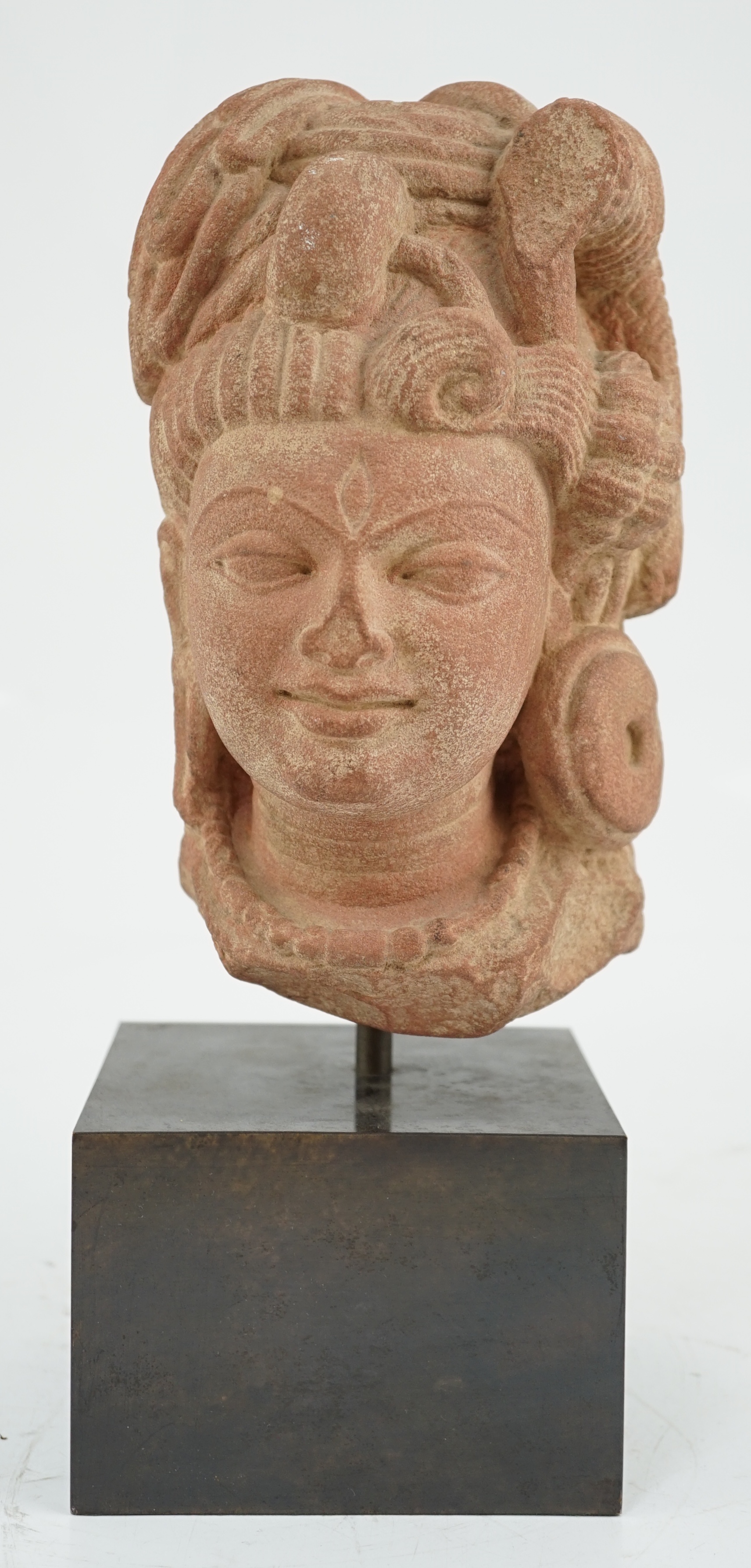 A red stone head of Ardhanarishvara, Muthura region, India, Gupta period, c.5th century A.D.